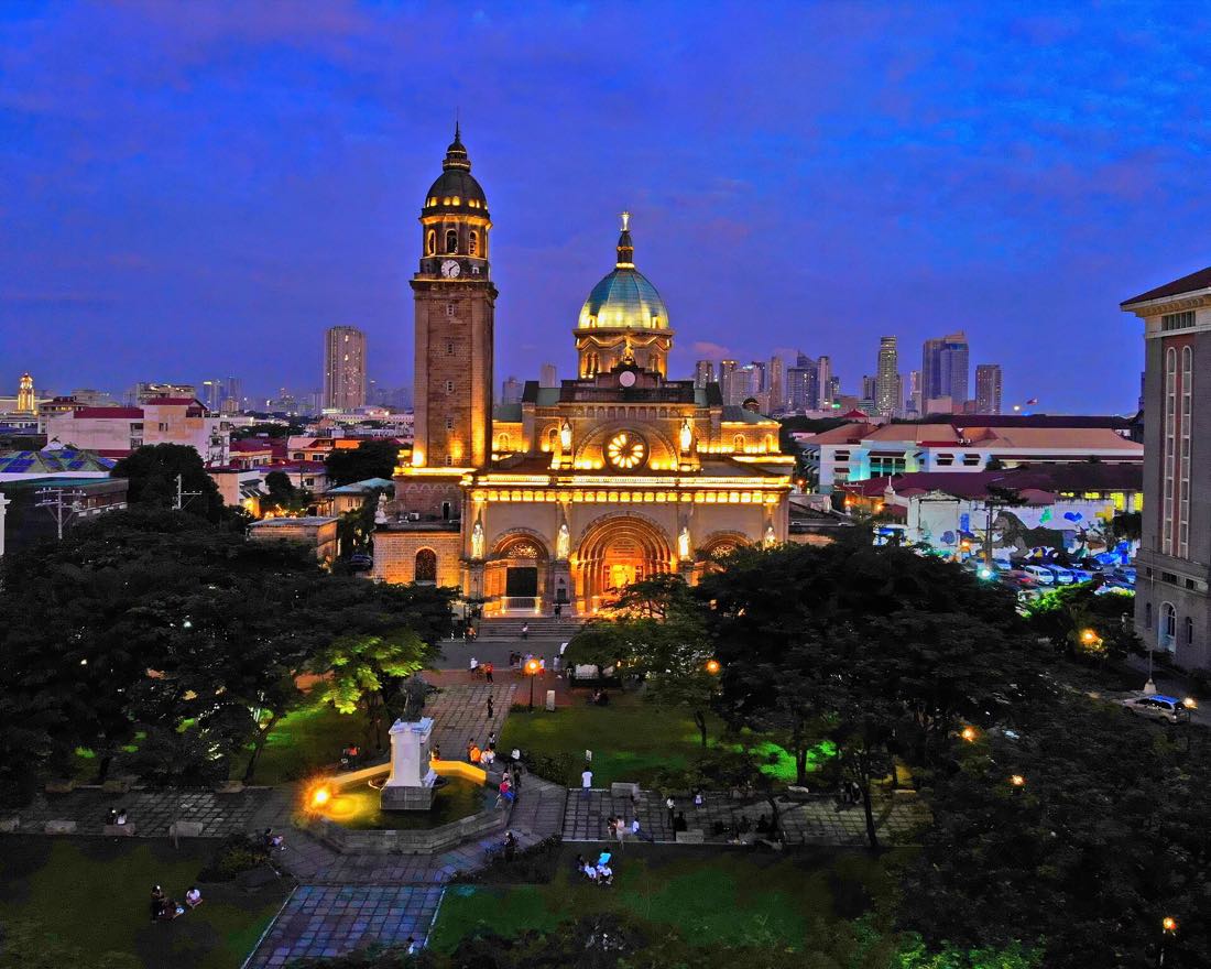 Manila Cathedral and the lights of Intramuros at night
