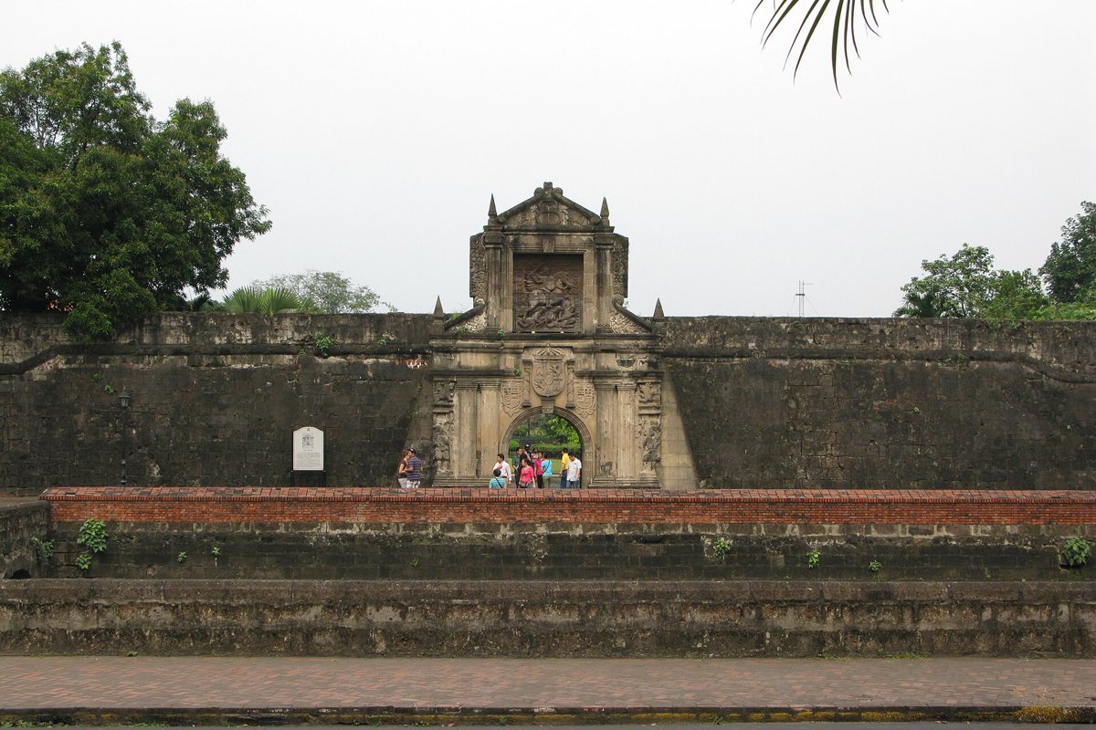 The walls of Intramuros flying the Philippine flag, Manila